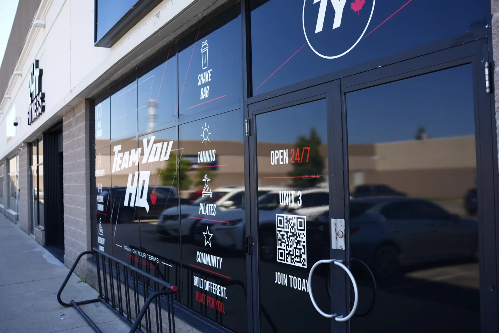 TeamYou HQ Unit 3 storefront with shake bar, tanning and pilates window graphics
